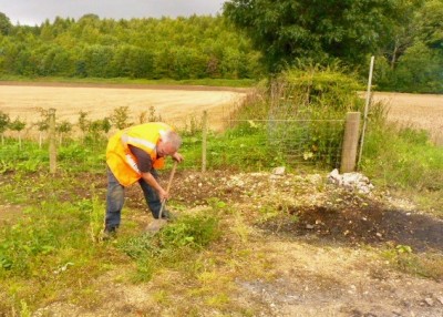 Site manager Keith hard at it with a spade.